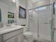 Well-lit bathroom featuring a glass enclosed shower and a vanity with modern fixtures at 3704 Via Monte Napoleone Dr, Poinciana, FL 34759