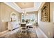 Elegant dining room featuring a modern chandelier, stylish rug and a window with plantation shutters at 3704 Via Monte Napoleone Dr, Poinciana, FL 34759