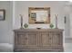 Elegant entryway with a decorative console table and ornate mirror at 3704 Via Monte Napoleone Dr, Poinciana, FL 34759