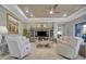 Cozy living room with coffered ceiling, a ceiling fan, and comfortable seating arrangements at 3704 Via Monte Napoleone Dr, Poinciana, FL 34759