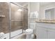 Cozy bathroom featuring a tiled shower with glass door, and granite countertop at 3974 Lana Ave, Davenport, FL 33897