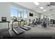 Well-equipped fitness center with treadmills, bikes, weights, and large windows offering a view at 3974 Lana Ave, Davenport, FL 33897