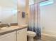 Bright bathroom features a shower-tub combo and a single sink vanity at 4560 Daugharty Rd, De Leon Springs, FL 32130