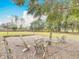 Outdoor fire pit seating area with string lights creates a cozy ambiance at 4560 Daugharty Rd, De Leon Springs, FL 32130