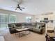 Open-concept living room flowing into the kitchen area, perfect for entertaining at 4560 Daugharty Rd, De Leon Springs, FL 32130