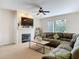 Cozy living room featuring a fireplace, large windows, and comfortable seating at 4560 Daugharty Rd, De Leon Springs, FL 32130