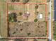 Aerial view outlining the property lines, home, and barn at 4560 Daugharty Rd, De Leon Springs, FL 32130