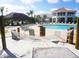 Sandy beach area with a hammock and pool in the background, perfect for resort-style living at 4967 Windermere Ave, Kissimmee, FL 34746