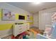 Bright bedroom, features a TV, a dresser, and a colorful rug, offering a playful design at 4967 Windermere Ave, Kissimmee, FL 34746