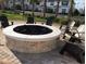 Outdoor fire pit with seating area, perfect for relaxing and socializing in the community at 4967 Windermere Ave, Kissimmee, FL 34746