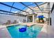 Backyard pool area with in-pool floats, lounge chairs, and covered dining space, ideal for outdoor enjoyment at 4967 Windermere Ave, Kissimmee, FL 34746