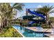 Community water park area showcasing a large winding waterslide and lazy river at 4967 Windermere Ave, Kissimmee, FL 34746