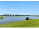 Scenic water view overlooking the lake and bridge, with well-maintained lawns for community residents and guests at 4967 Windermere Ave, Kissimmee, FL 34746