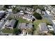 Aerial view of neighborhood homes with mature trees, landscaping and parking spaces at 643 Captiva Cir, Kissimmee, FL 34741