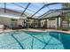 Gorgeous pool area featuring an inviting pool surrounded by a screened enclosure and ample seating at 736 W Pinewood Ct, Lake Mary, FL 32746