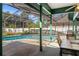 Relaxing screened-in pool area with outdoor dining and views of the lush backyard at 736 W Pinewood Ct, Lake Mary, FL 32746