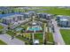 Beautiful aerial view of community amenities including pool, tennis court, and green spaces at 7545 Laureate Blvd # 7202, Orlando, FL 32827