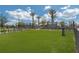 Large green dog park with secure fencing and a playful atmosphere for community residents at 7545 Laureate Blvd # 7202, Orlando, FL 32827