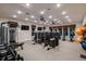 Well-equipped gym with modern exercise machines and weights for a complete workout experience at 7545 Laureate Blvd # 7202, Orlando, FL 32827