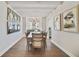 Elegant dining room featuring a chandelier, modern decor, and a hardwood floor at 7545 Laureate Blvd # 7203, Orlando, FL 32827