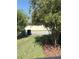 View of the front yard featuring lush landscaping and curb appeal at 7873 Dausset St, Orlando, FL 32827