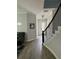 Hallway featuring wood-look flooring, modern lighting, and staircase at 7873 Dausset St, Orlando, FL 32827