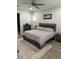 Comfortable main bedroom features a neutral color scheme and ample natural light at 7873 Dausset St, Orlando, FL 32827