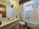 Bathroom featuring a single sink vanity and a shower/tub combo at 794 Elwood St, Deltona, FL 32725