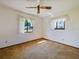 Bedroom with fan and neutral carpet, two windows let in ample light at 794 Elwood St, Deltona, FL 32725