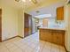 Well lit kitchen featuring tile flooring, stainless steel appliances, and ample counter space at 794 Elwood St, Deltona, FL 32725