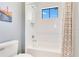 Bright white bathroom with a tiled shower and a large bathtub at 831 W Harvard St, Orlando, FL 32804