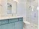 Modern bathroom featuring a sleek vanity, a large mirror, and glass-enclosed shower at 831 W Harvard St, Orlando, FL 32804