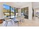 Bright dining room with modern lighting and floor-to-ceiling windows offering pool view at 831 W Harvard St, Orlando, FL 32804