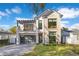 Beautiful two-story home with stone accents, modern garage door and balcony at 831 W Harvard St, Orlando, FL 32804