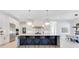 Modern kitchen with a large island, pendant lighting, and stainless steel appliances at 831 W Harvard St, Orlando, FL 32804