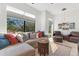 Inviting living room featuring comfortable seating, a decorative rug, and large windows for natural light at 831 W Harvard St, Orlando, FL 32804