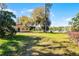 House with a large yard that leads to a scenic lake at 866 Gatlin Ave, Orlando, FL 32806