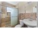 Bathroom featuring tiled shower with glass door, toilet, and vanity sink at 866 Gatlin Ave, Orlando, FL 32806