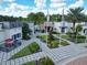 Aerial view of the community clubhouse featuring outdoor dining and a resort-style pool at 929 Conch Rd, Davenport, FL 33896