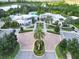 Community clubhouse aerial view highlighting the manicured entrance, landscaping, and ample parking at 929 Conch Rd, Davenport, FL 33896