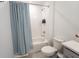 Clean bathroom featuring a vanity with quartz countertops and a shower-tub combo at 929 Conch Rd, Davenport, FL 33896