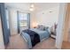 Comfortable bedroom with a queen-size bed and ample natural light at 929 Conch Rd, Davenport, FL 33896