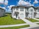 Charming two-story townhome with lush lawn, one-car garage, and inviting curb appeal at 929 Conch Rd, Davenport, FL 33896