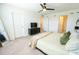 Bright and airy bedroom featuring a TV, closet, and ensuite bathroom entrance at 929 Conch Rd, Davenport, FL 33896