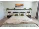 Comfortable bedroom with a large bed, stylish lamps, modern decor, and neutral tones at 929 Conch Rd, Davenport, FL 33896