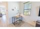 Well-lit office nook with modern desk, chair, and large window offering natural light at 929 Conch Rd, Davenport, FL 33896