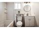 Cozy bathroom featuring a shower-tub combination, stylish vanity, and neutral decor at 9400 Ne 307Th Ct, Fort Mc Coy, FL 32134