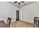 Bedroom with ceiling fan, carpet, and door to hallway and adjacent room at 9472 Sw 76Th St, Ocala, FL 34481