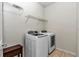 Laundry room with front loading washer and dryer and wire shelving at 9472 Sw 76Th St, Ocala, FL 34481