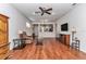 Living room featuring hardwood floors, ceiling fan, and neutral colors at 9472 Sw 76Th St, Ocala, FL 34481